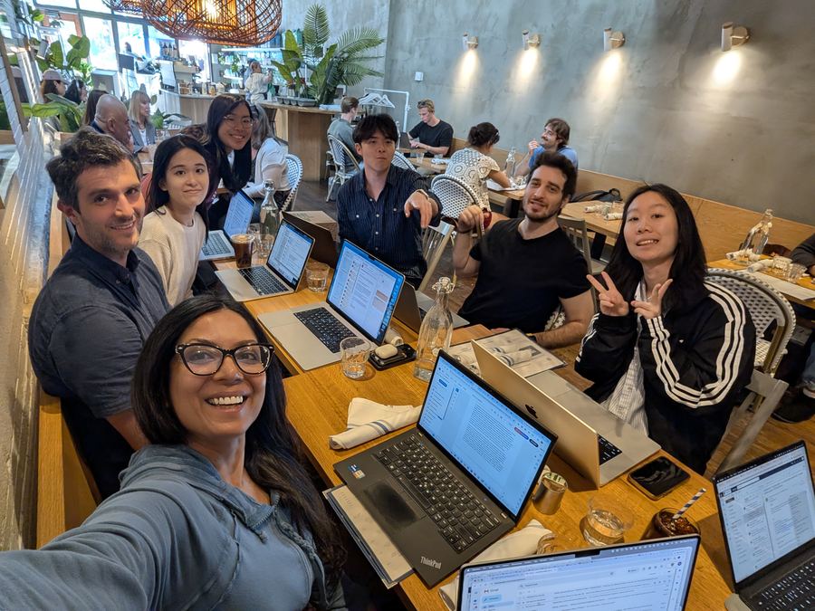 Lekshmi with members of the Cultural Dynamics Lab working at a café table